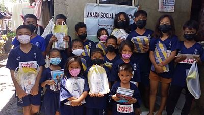 Beneficiaries of the Foundation's school in the Philippines receive resources for the new school year