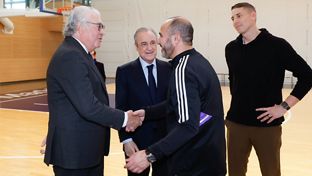 The Club President, with the basketball squad and Carroll