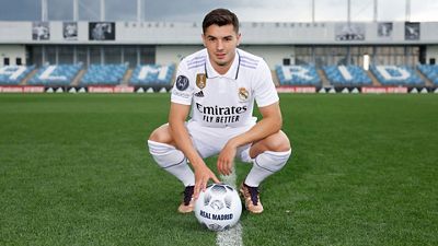 Brahim poses in the Real Madrid jersey