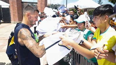 The squad signs autographs at UCLA
