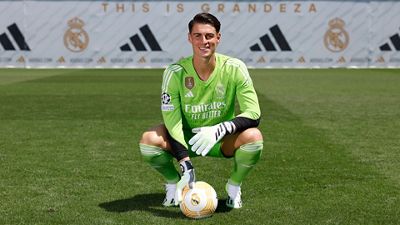 Kepa poses in the Real Madrid jersey